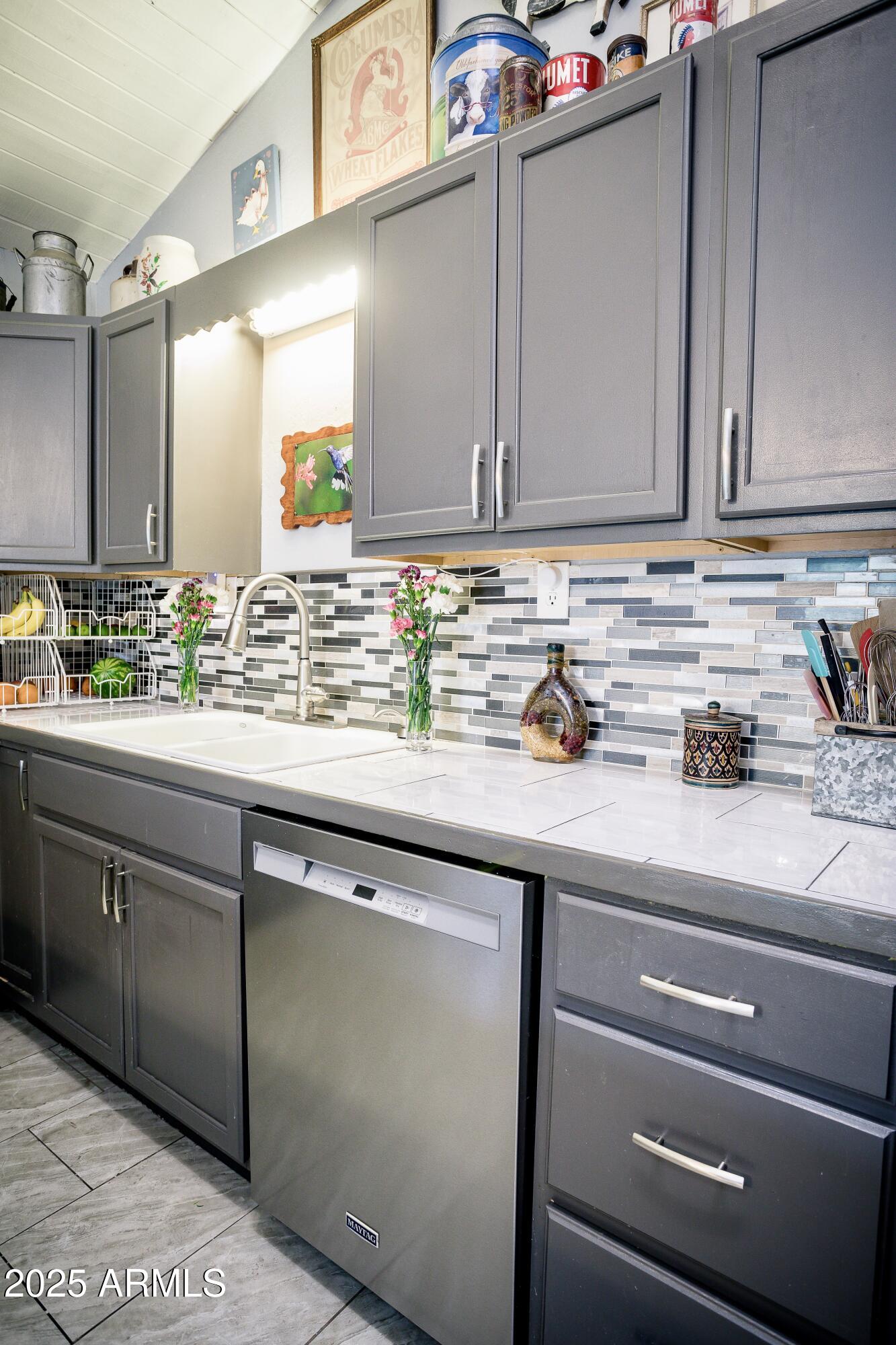 29 East Ramsey Canyon Road Hereford, AZ 85615 - Photo 9 of 119 a sink with granite countertop a sink and cabinets