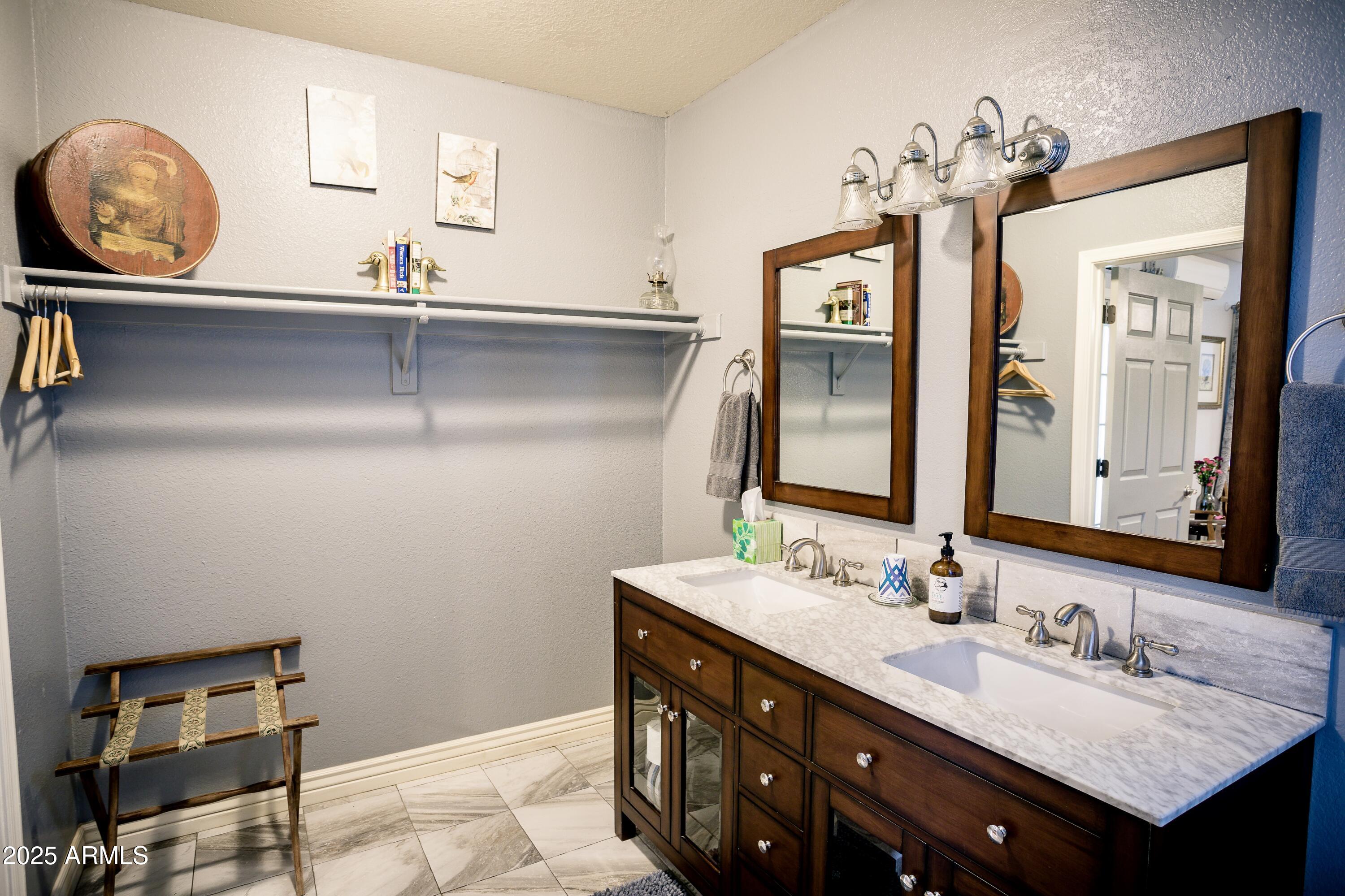 29 East Ramsey Canyon Road Hereford, AZ 85615 - Photo 18 of 119 a bathroom with a sink and a mirror