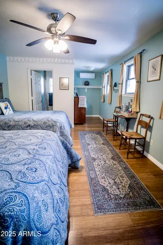 a kitchen with granite countertop a stove a sink and wooden cabinetry