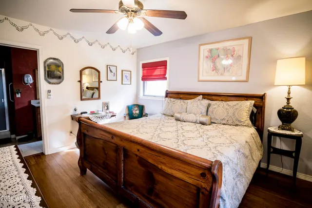 a bed sitting in a bedroom next to a window