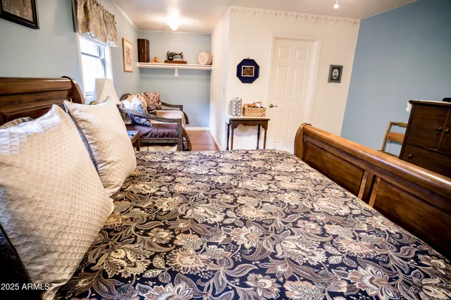 a bathroom with a granite countertop sink a toilet and a mirror