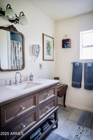 a room with a mirror and furniture