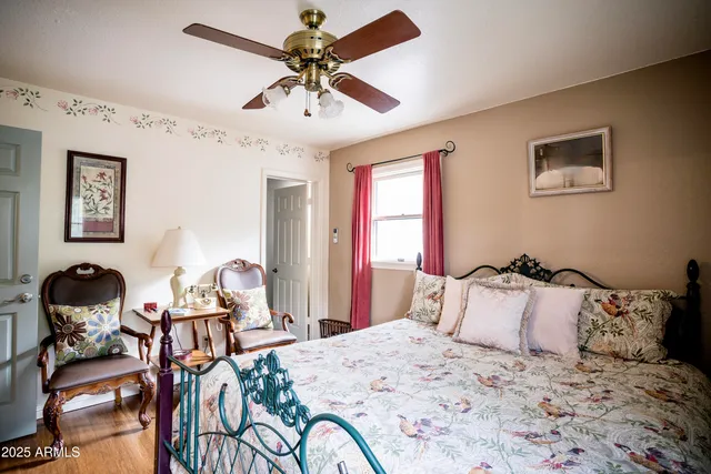 a bedroom with a bed and a desk