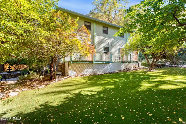 a dining room with furniture a rug and wooden floor