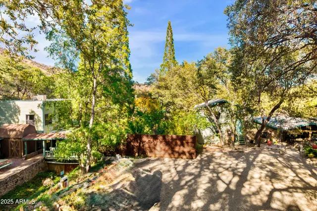 a bedroom with furniture and a flat screen tv