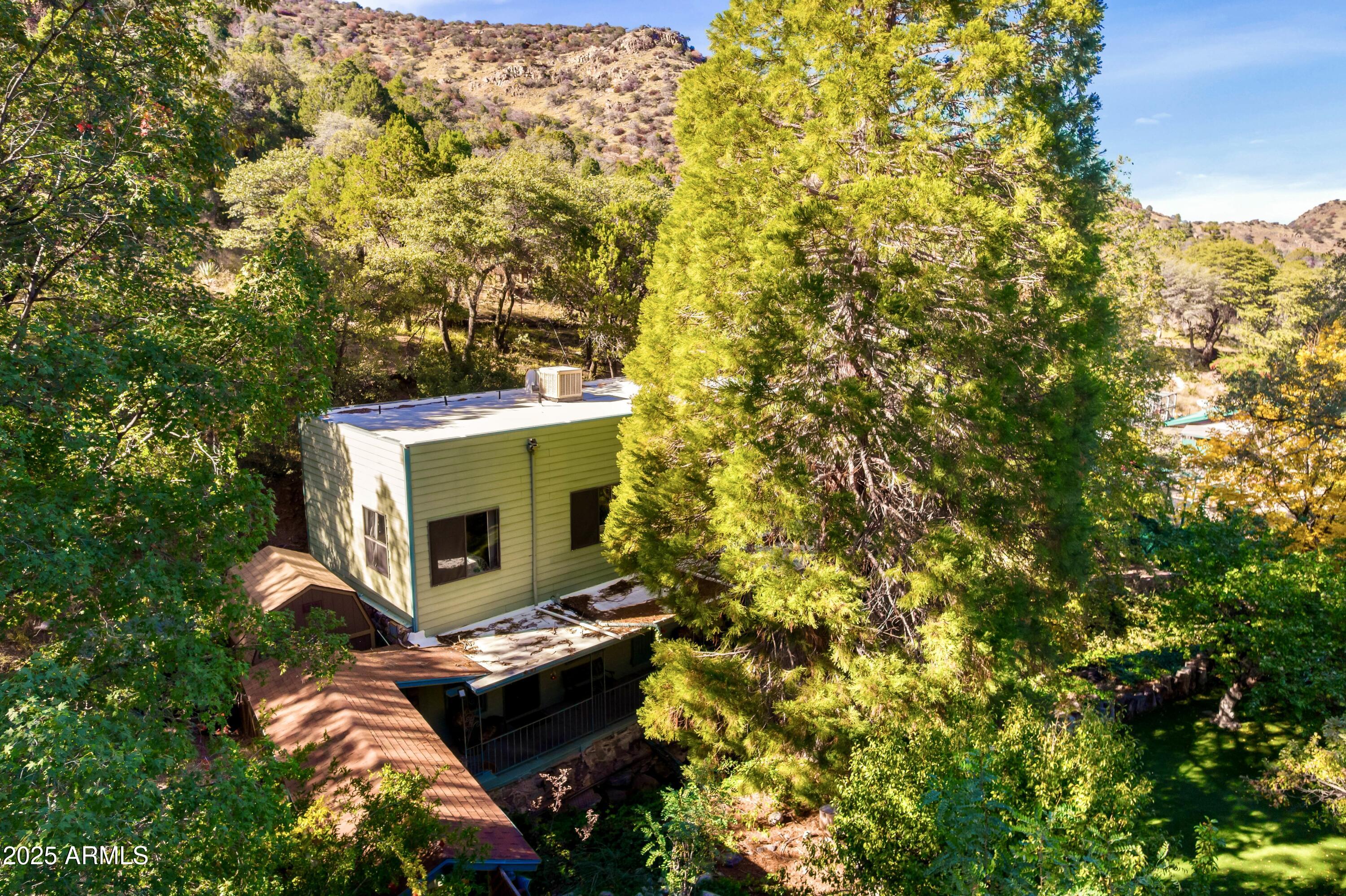 29 East Ramsey Canyon Road Hereford, AZ 85615 - Photo 42 of 119 a backyard of a house with a yard and outdoor seating