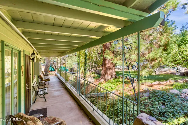 a backyard of a house with barbeque oven table and chairs