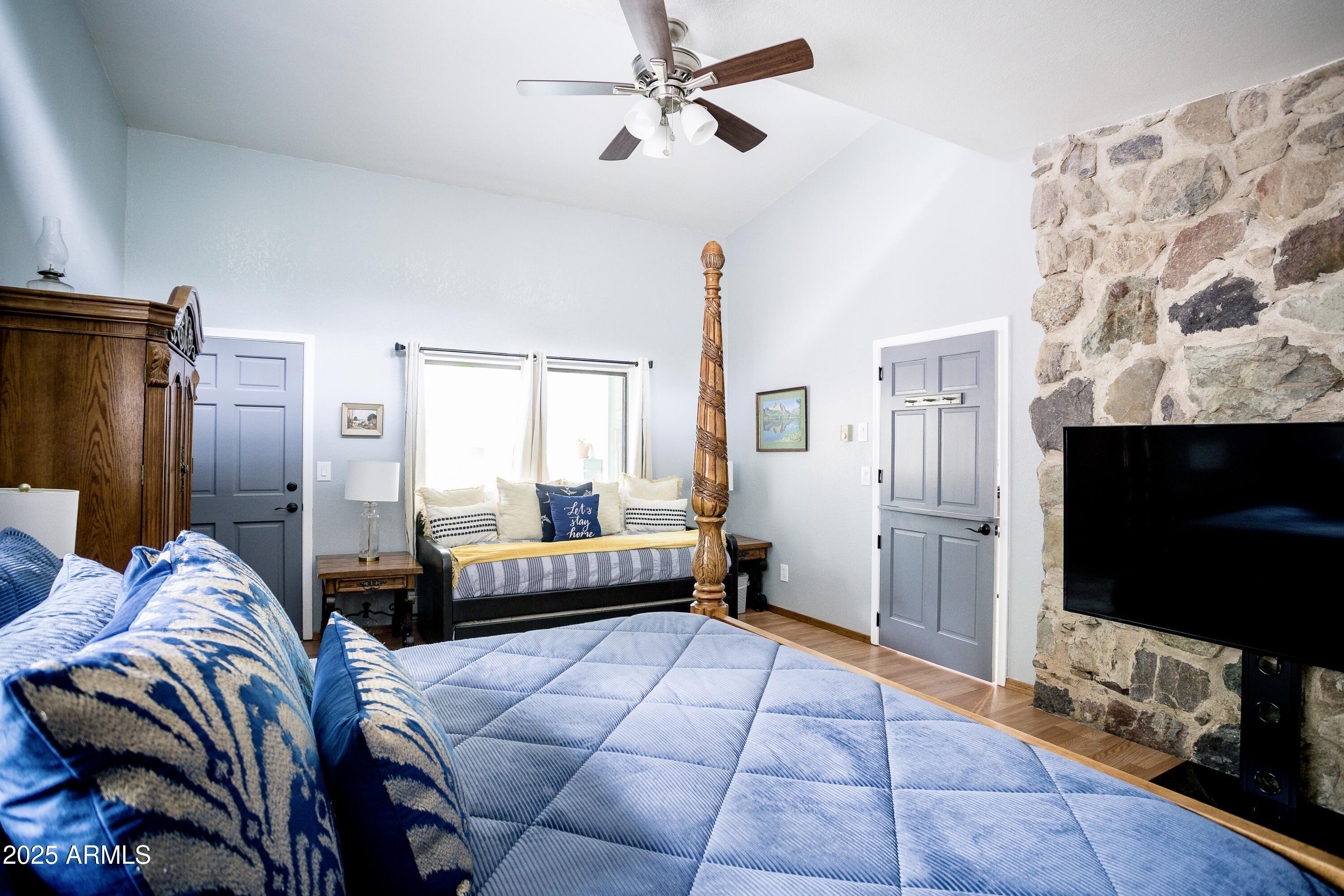 29 East Ramsey Canyon Road Hereford, AZ 85615 - Photo 90 of 119 a bedroom with furniture and a flat screen tv