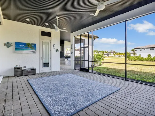 a view of a living room and floor to ceiling window