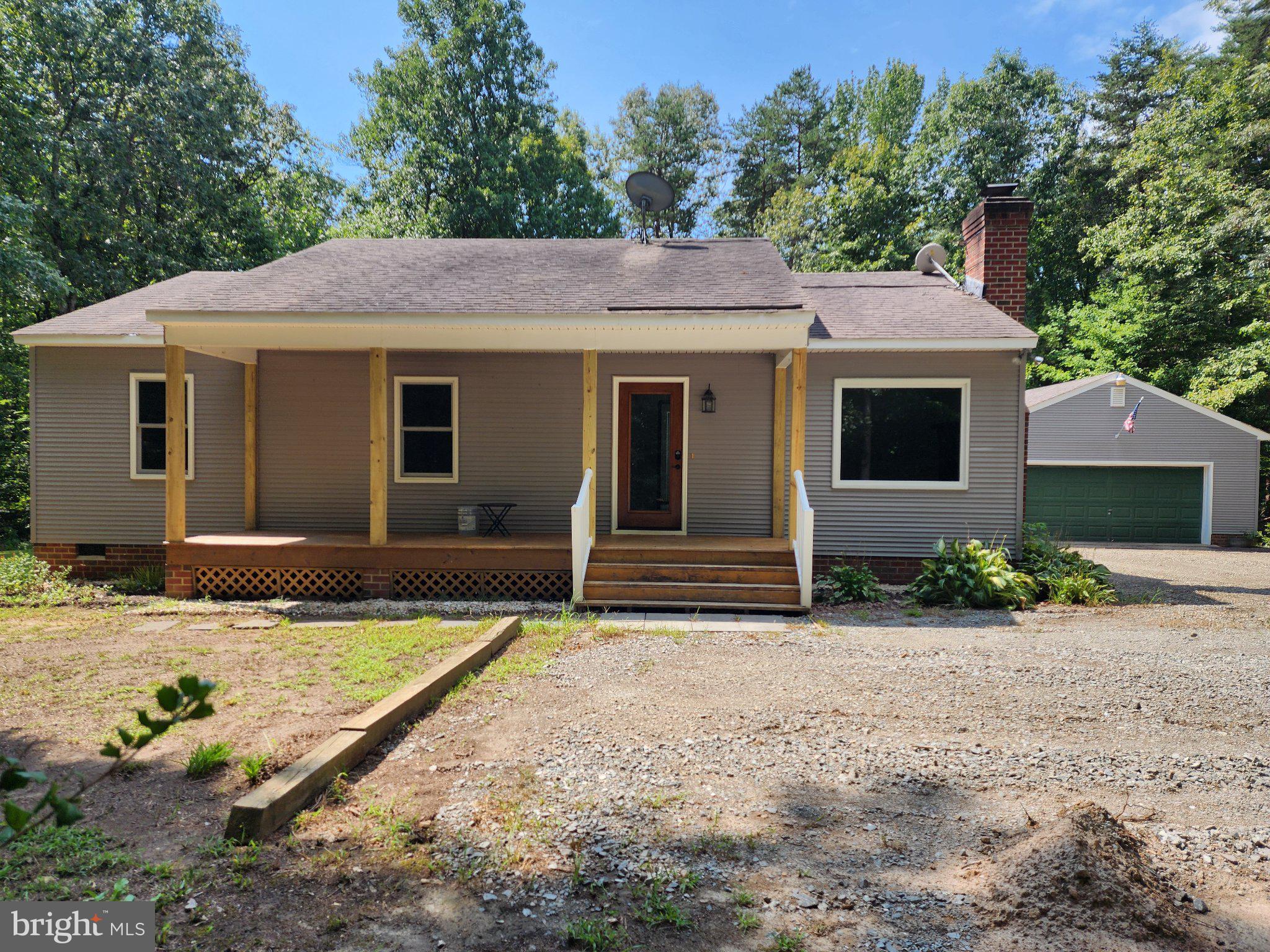 652 Jackson Road Bumpass, VA 23024 - Photo 2 of 18 Charming home nestled in nature's embrace.