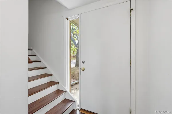 a view of entryway with wooden floor