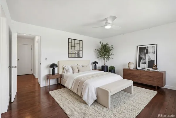 a spacious bedroom with a large bed and a couch