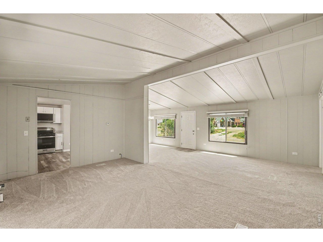 8317 6th Street Wellington, CO 80549 - Photo 6 of 21 Open-concept living and dining spaces