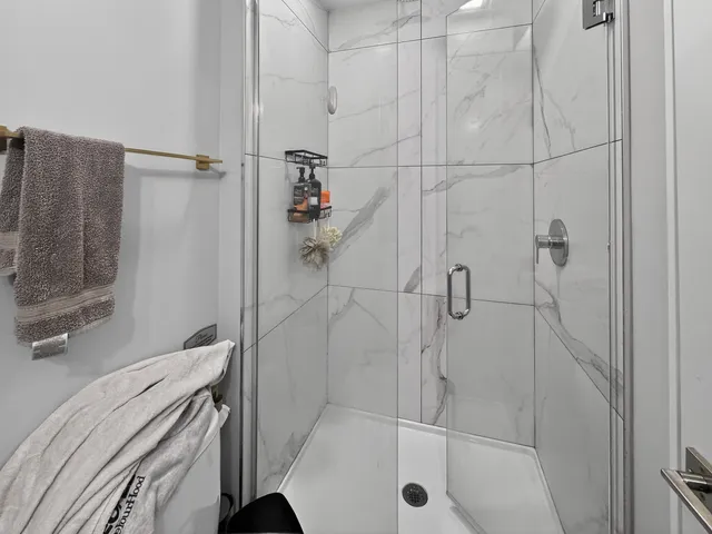 a bathroom with a bathtub and a shower