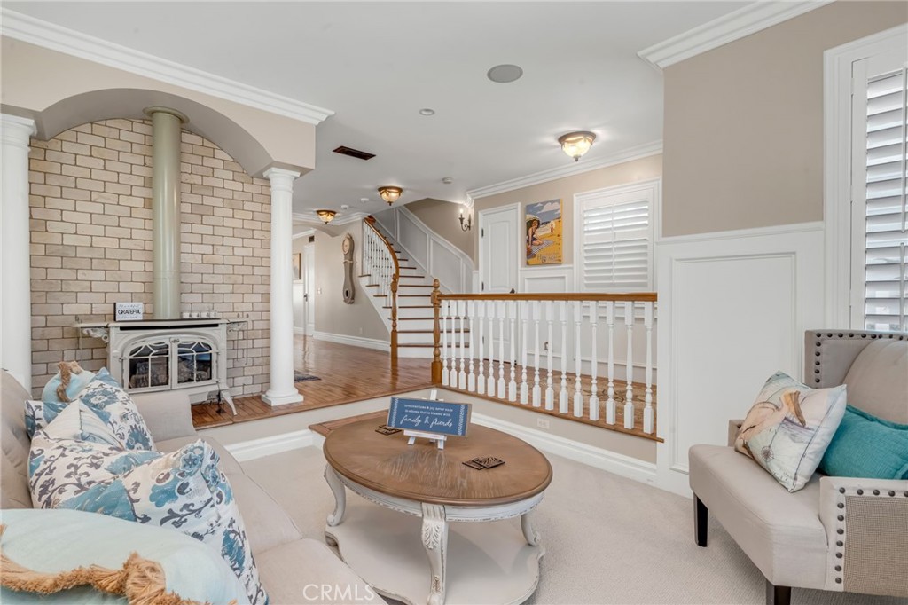 309 21st Street Huntington Beach, CA 92648 - Photo 11 of 38 a living room with furniture and a window