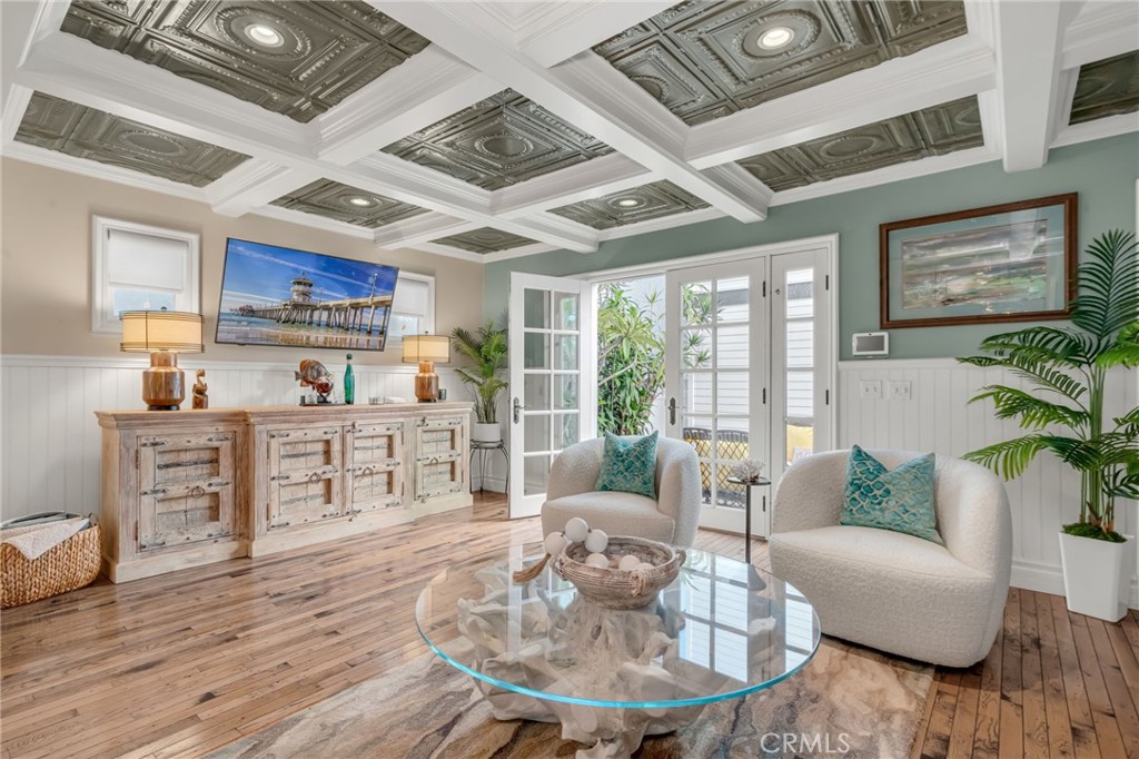 309 21st Street Huntington Beach, CA 92648 - Photo 14 of 38 a living room with furniture large window and wooden floor