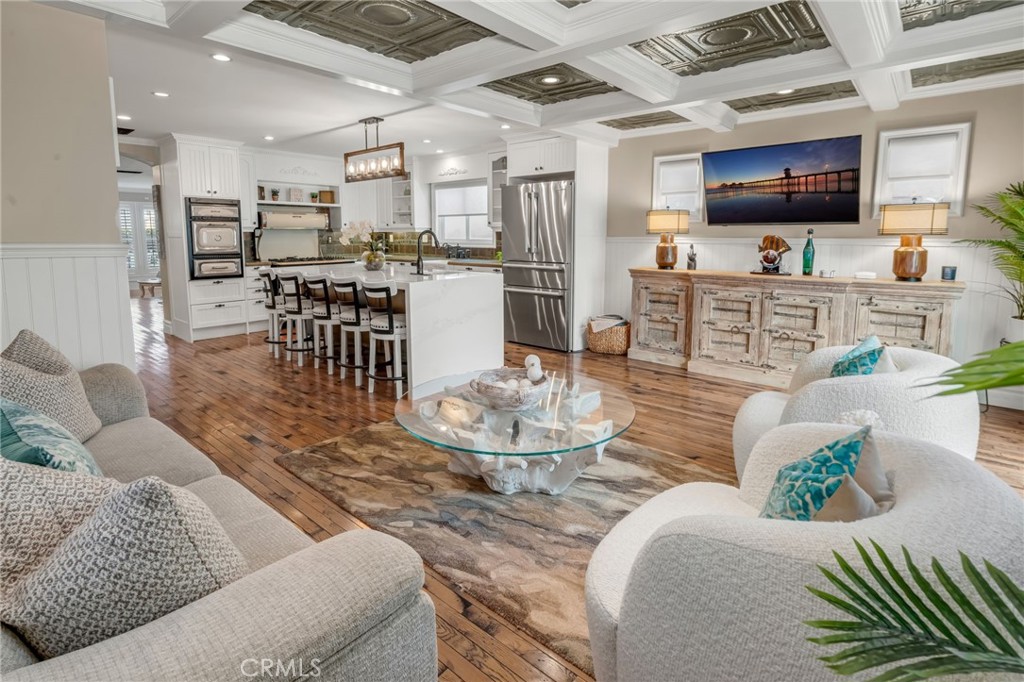 309 21st Street Huntington Beach, CA 92648 - Photo 15 of 38 a living room with lots of furniture and kitchen view