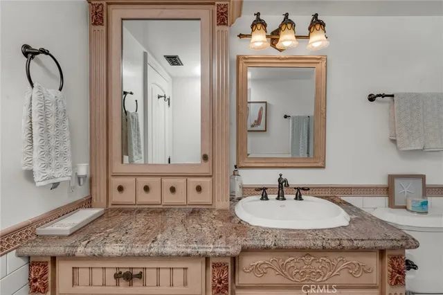 a view of a balcony with furniture and a large window