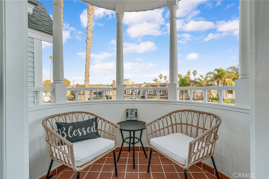 309 21st Street Huntington Beach, CA 92648 - Photo 21 of 38 a view of a balcony with furniture and a large window