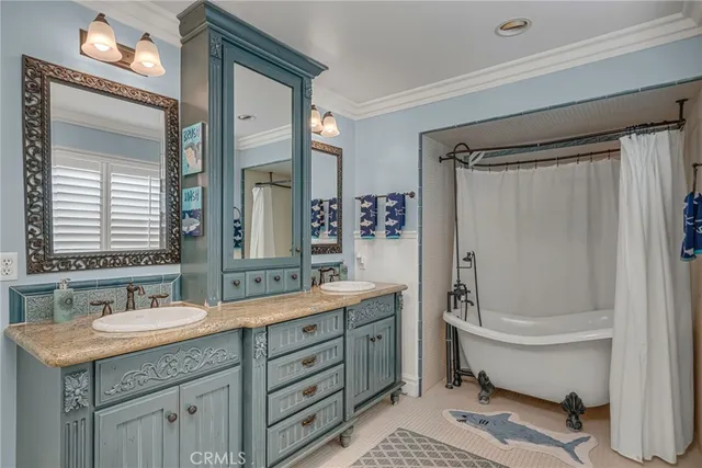 a bedroom with a bed and cabinet