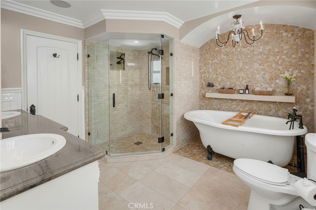 309 21st Street Huntington Beach, CA 92648 - Photo 28 of 38 a bathroom with a granite countertop sink a toilet and shower