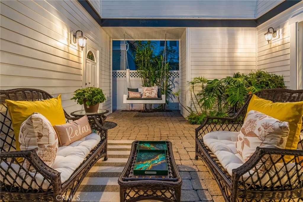 309 21st Street Huntington Beach, CA 92648 - Photo 4 of 38 a balcony with furniture and a potted plant
