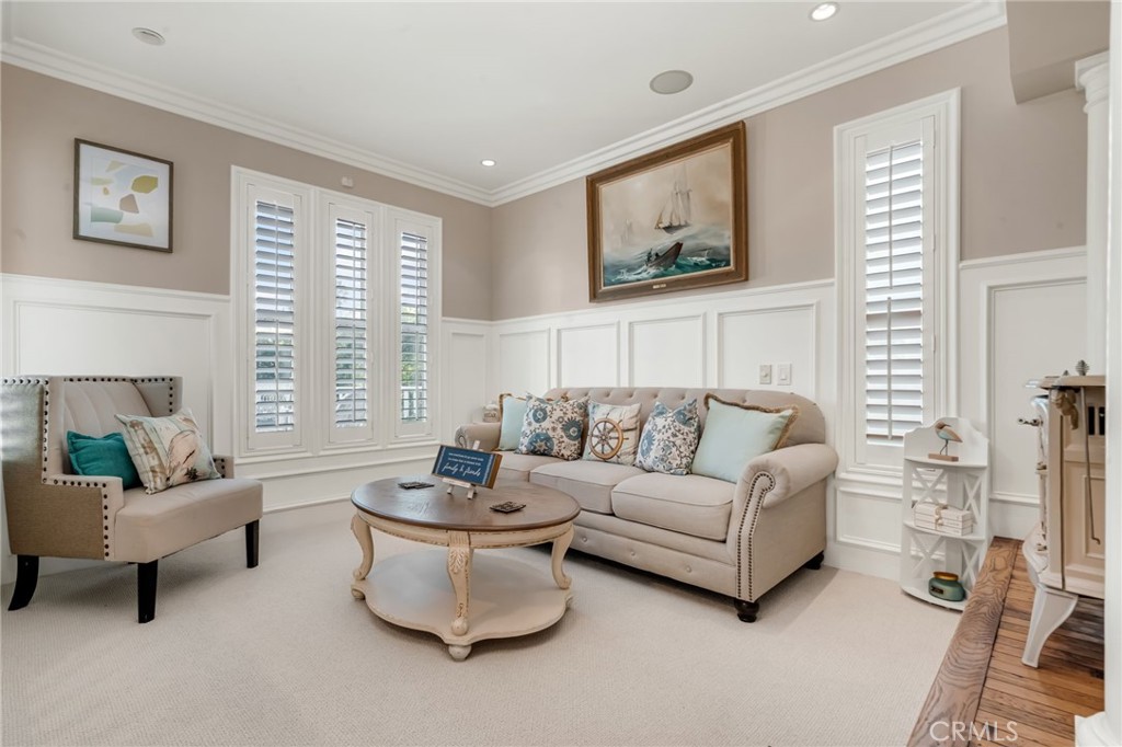 309 21st Street Huntington Beach, CA 92648 - Photo 10 of 38 a living room with furniture and a large window