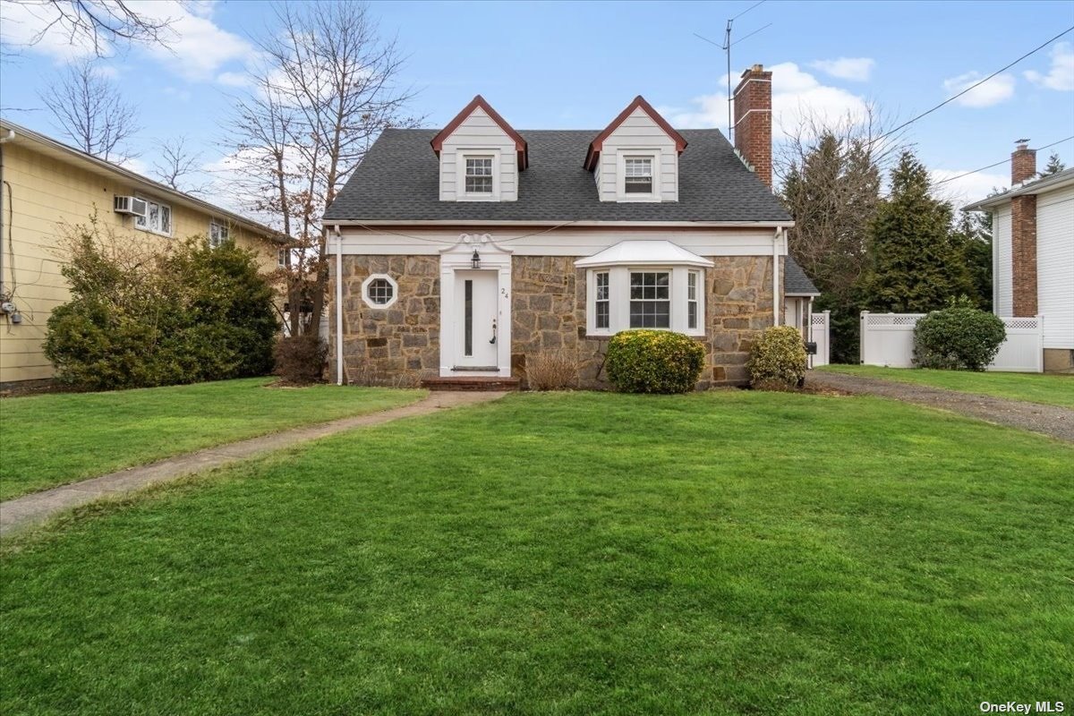 24 Clarendon Road Hempstead, NY 11550 - Photo 1 of 1 a front view of a house with garden