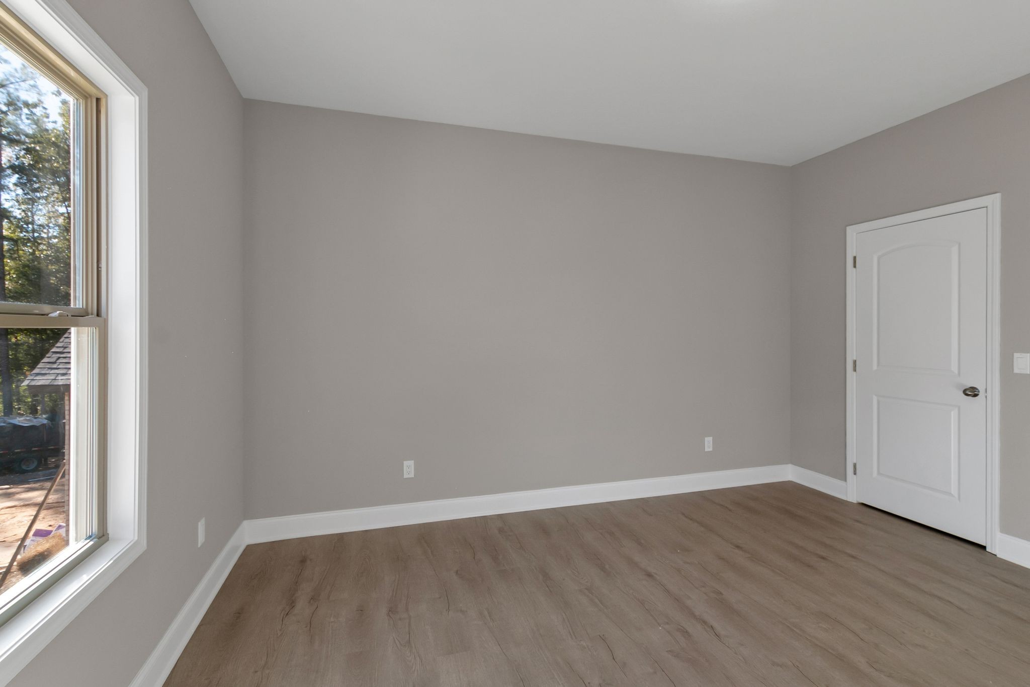 74 Mockingbird Lane Paris, TN 38242 - Photo 18 of 21 a view of an empty room with wooden floor and a window