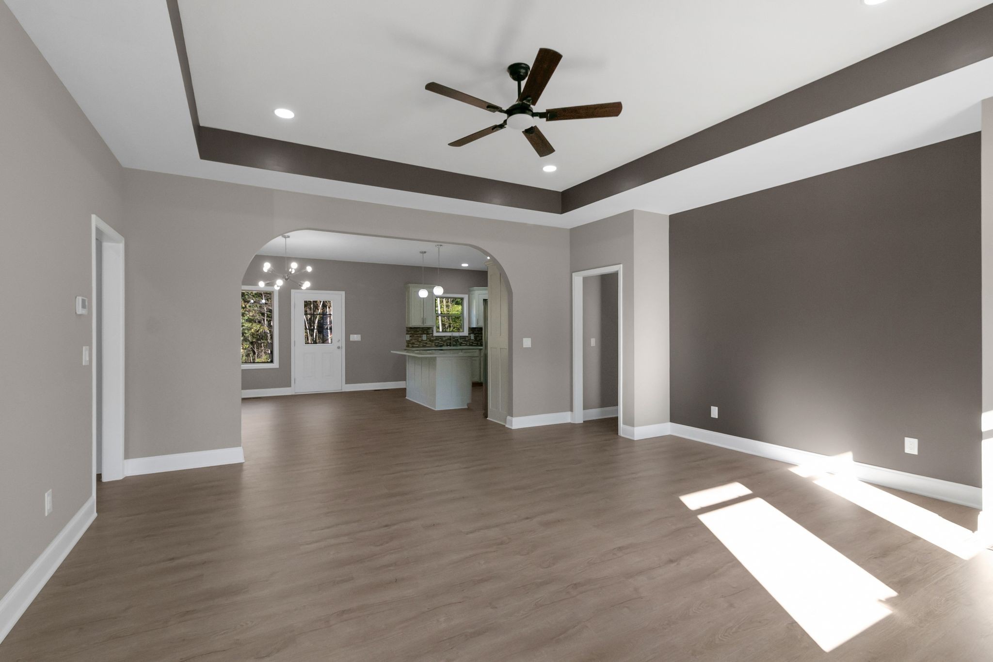 74 Mockingbird Lane Paris, TN 38242 - Photo 3 of 21 a view of a livingroom with a ceiling fan and wooden floor