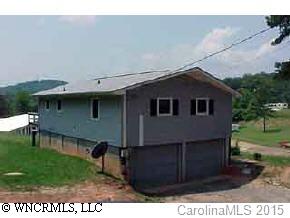 0 Angela Hart Lane Fairview, NC 28730 - Photo 2 of 4 a backyard of a house with table and chairs