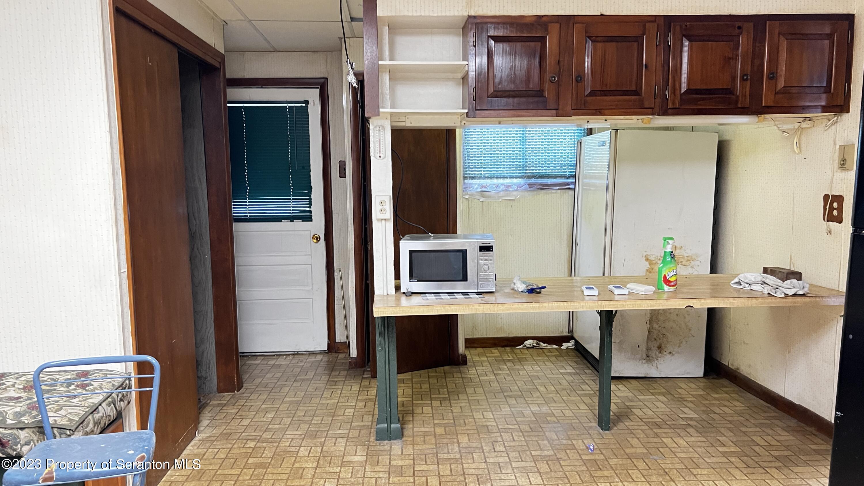 102 Wayne Street Carbondale, PA 18407 - Photo 12 of 21 a view of kitchen with stainless steel appliances kitchen island table and chairs