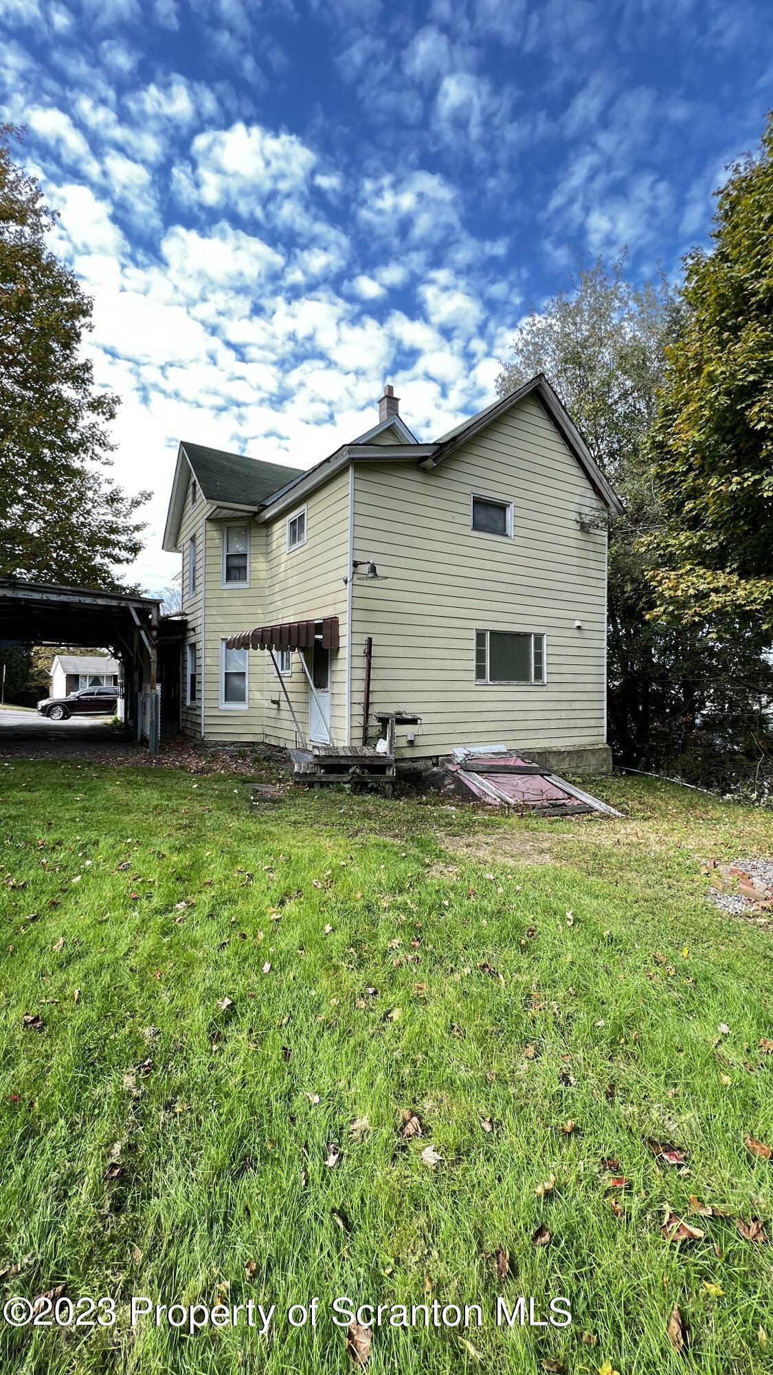 102 Wayne Street Carbondale, PA 18407 - Photo 3 of 21 a view of a house with a back yard