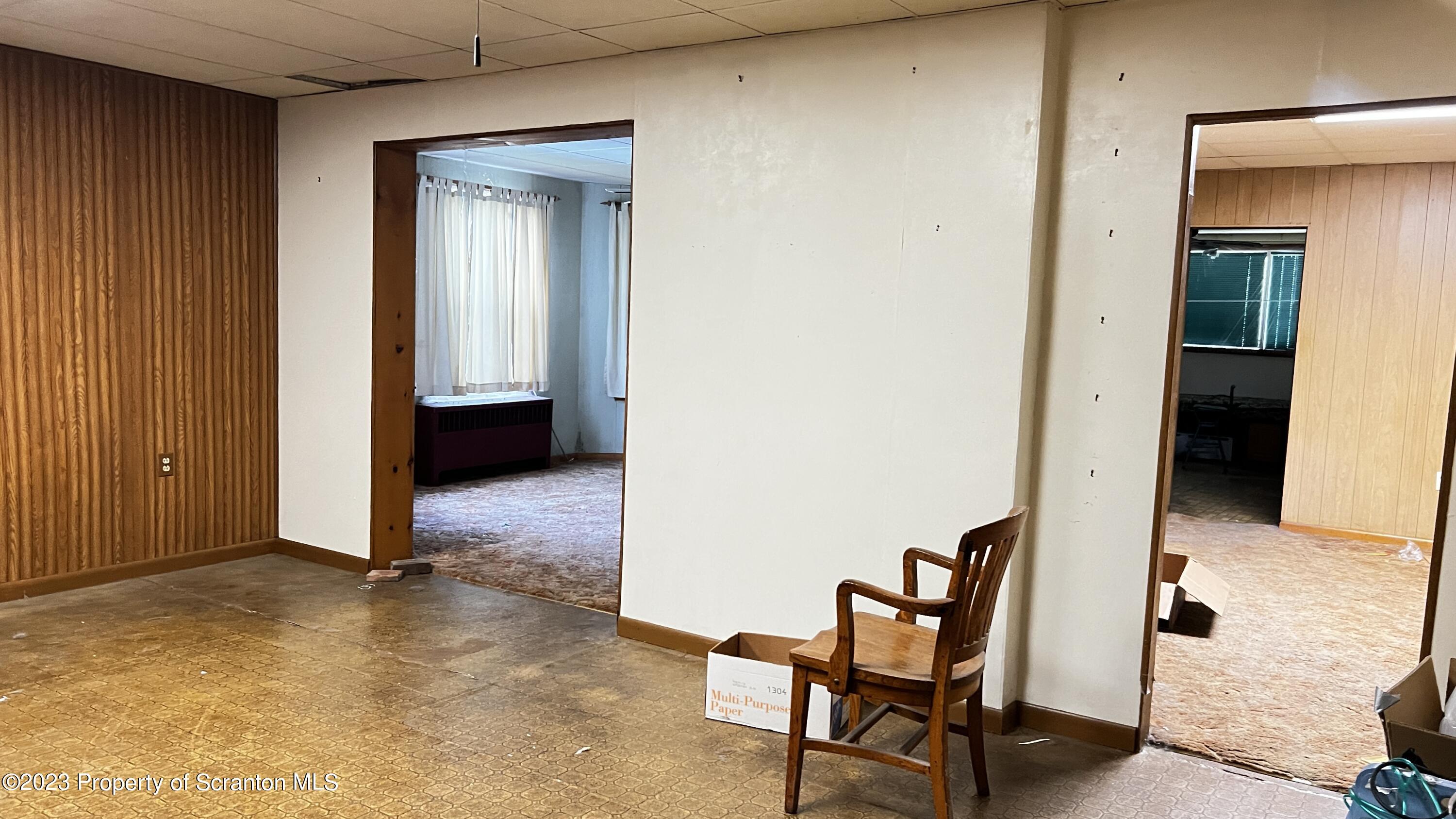 102 Wayne Street Carbondale, PA 18407 - Photo 7 of 21 a view of a livingroom with furniture and front door
