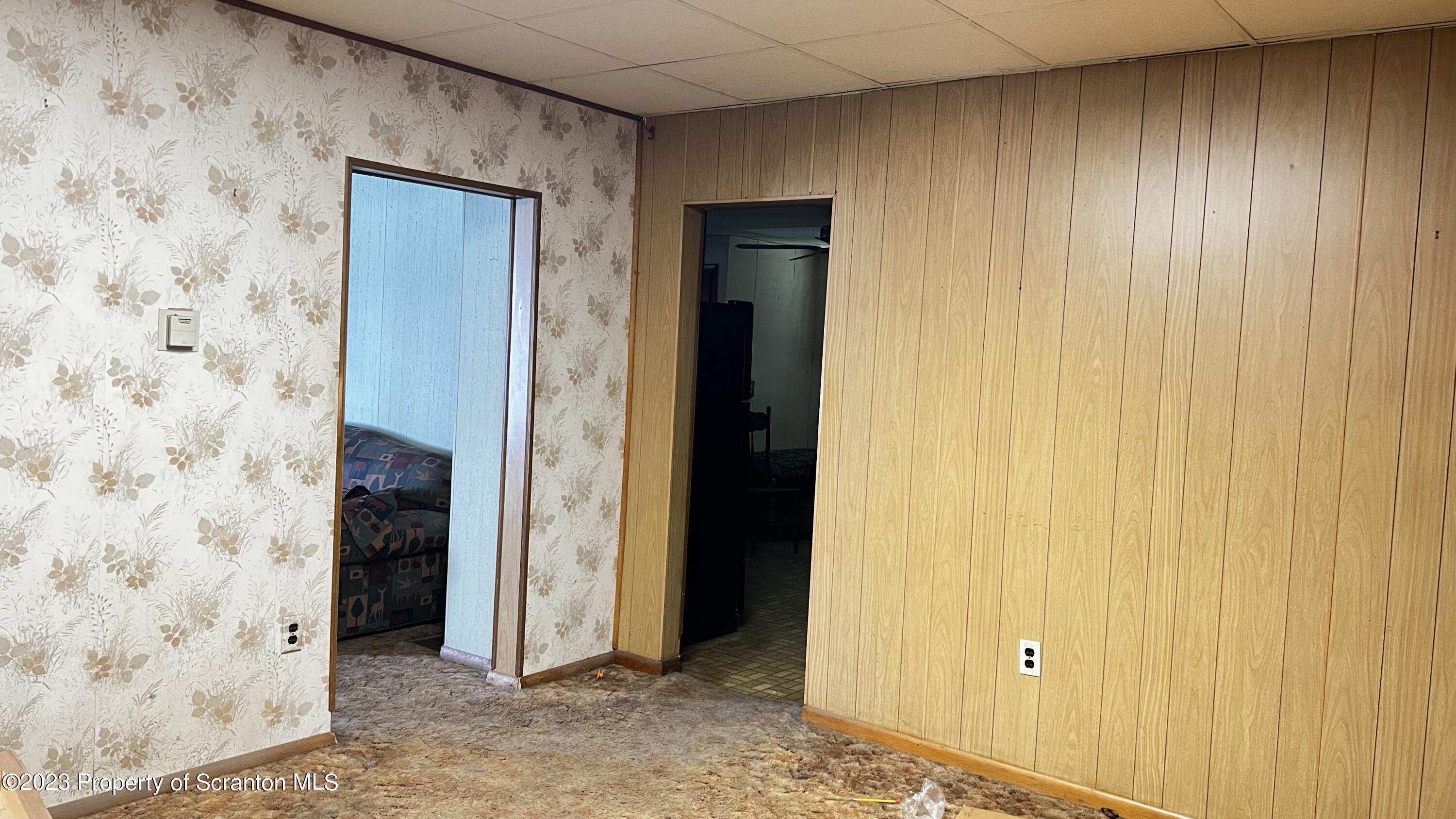 102 Wayne Street Carbondale, PA 18407 - Photo 8 of 21 a view of a hallway with a wooden door