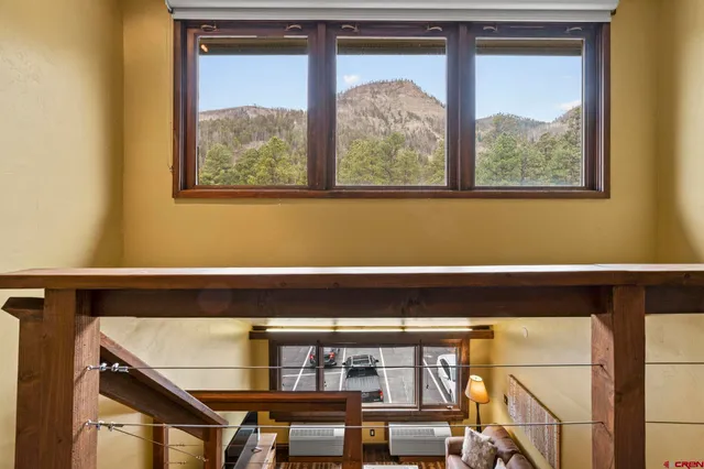 a view of a balcony with furniture