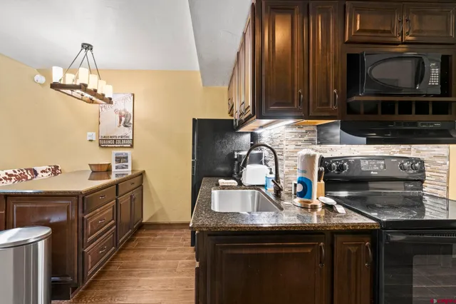 a kitchen with a sink and stove