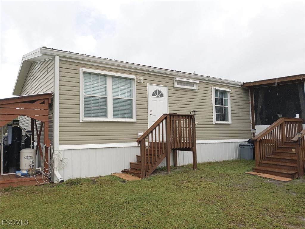 15582 Northwest 316th Street Okeechobee, FL 34972 - Photo 12 of 47 a porch with seating space