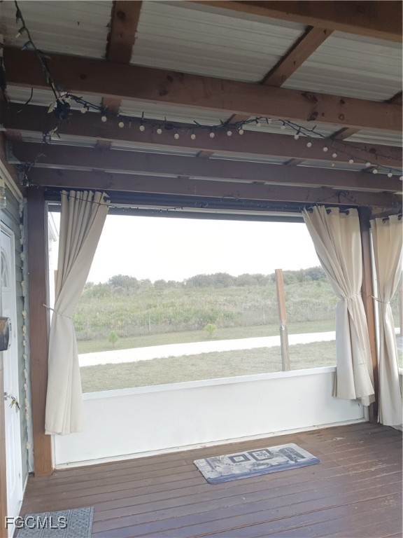 15582 Northwest 316th Street Okeechobee, FL 34972 - Photo 16 of 47 a view of a room with wooden floor and a window