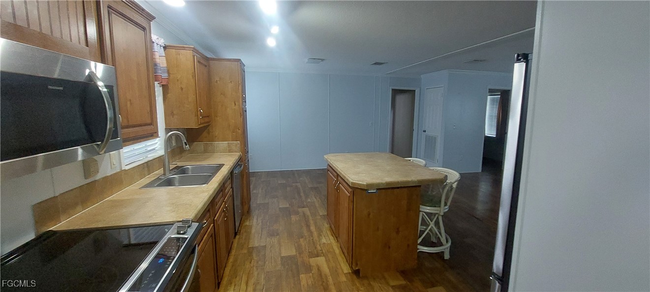 15582 Northwest 316th Street Okeechobee, FL 34972 - Photo 21 of 47 a bathroom with a sink a toilet and mirror