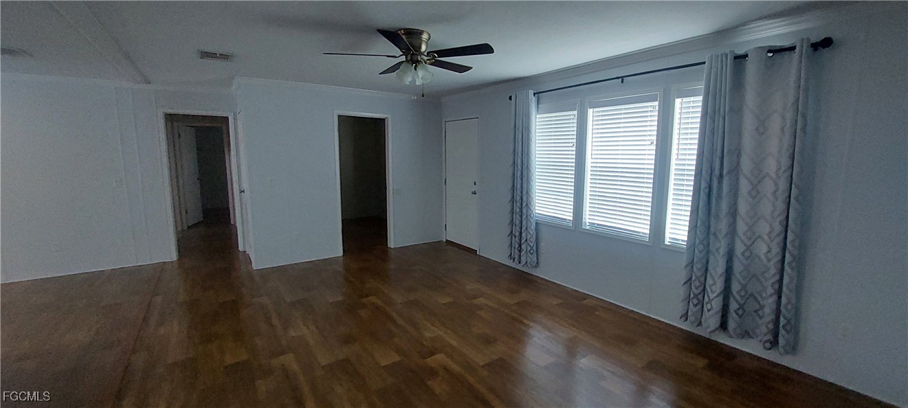 15582 Northwest 316th Street Okeechobee, FL 34972 - Photo 25 of 47 a view of a livingroom with a ceiling fan and window
