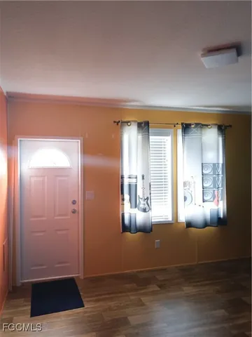 a view of livingroom with hardwood floor and hallway