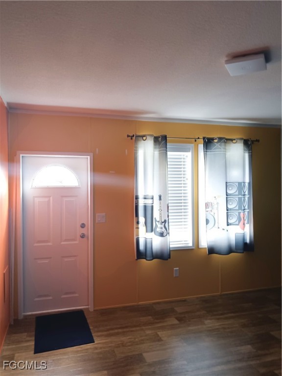 15582 Northwest 316th Street Okeechobee, FL 34972 - Photo 31 of 47 a view of livingroom with hardwood floor and hallway