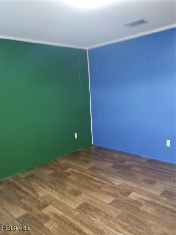 15582 Northwest 316th Street Okeechobee, FL 34972 - Photo 32 of 47 a view of a room with a wooden floor and a window
