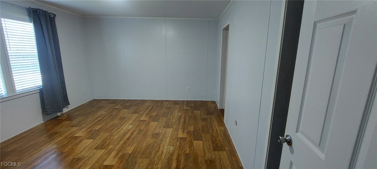 15582 Northwest 316th Street Okeechobee, FL 34972 - Photo 33 of 47 a view of a room with wooden floor and a window
