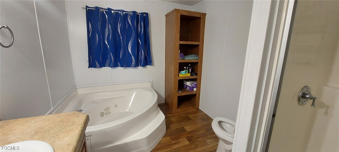 15582 Northwest 316th Street Okeechobee, FL 34972 - Photo 36 of 47 a bathroom with a tub and shower