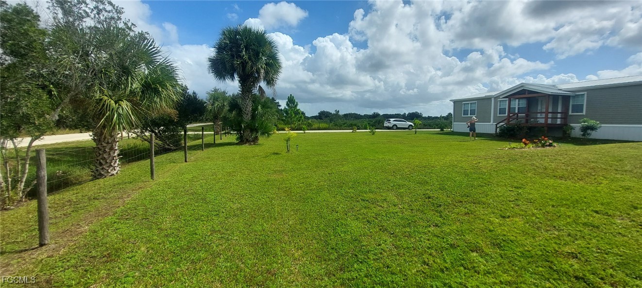 15582 Northwest 316th Street Okeechobee, FL 34972 - Photo 39 of 47 a view of a house with a big yard