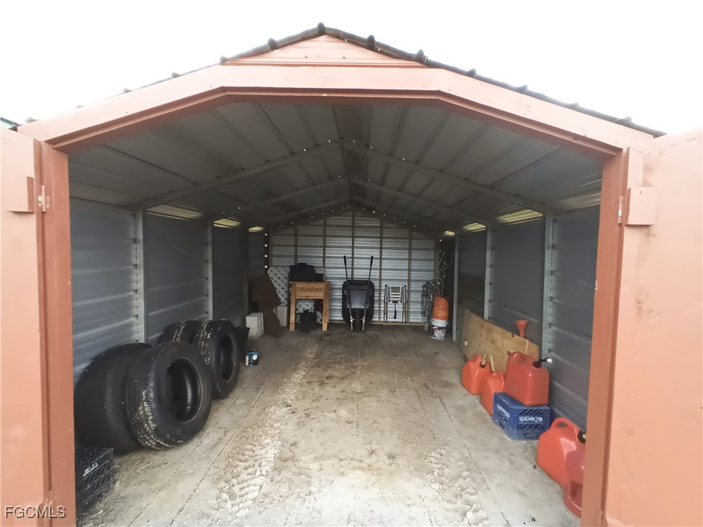 15582 Northwest 316th Street Okeechobee, FL 34972 - Photo 45 of 47 a view of a room with storage and utility