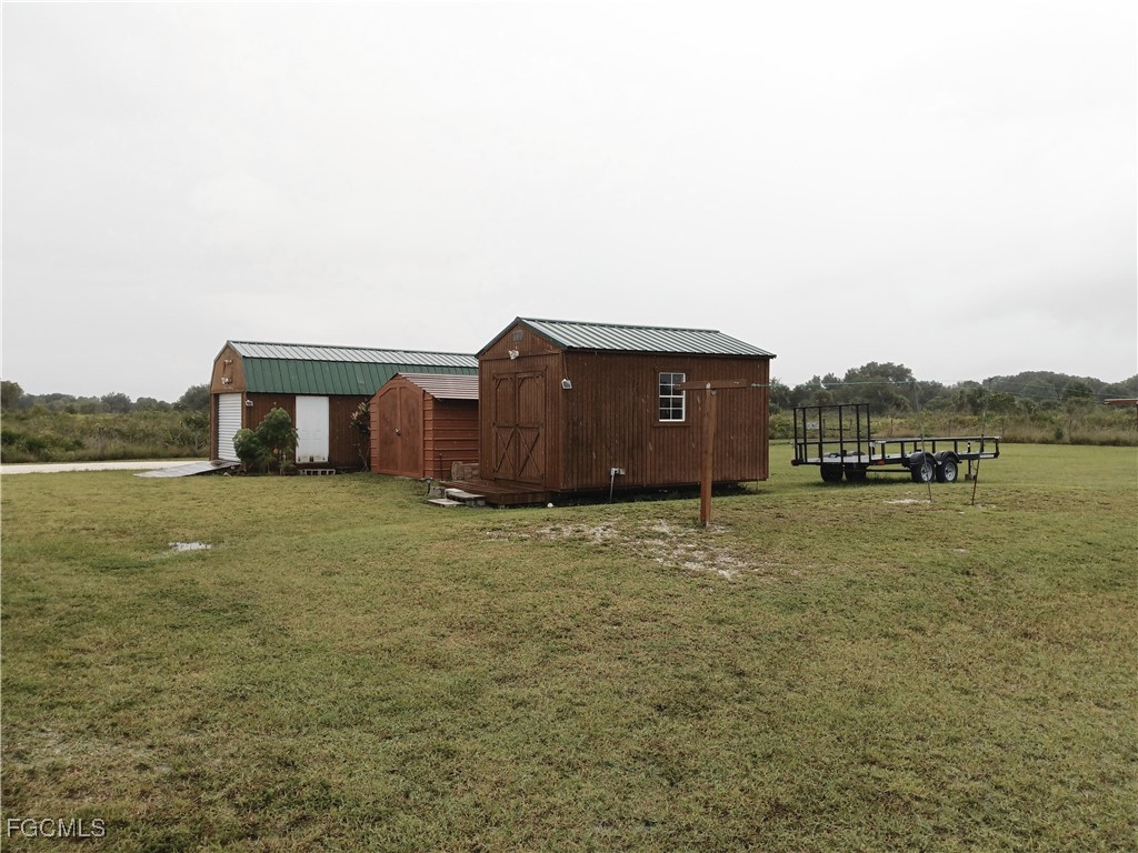 15582 Northwest 316th Street Okeechobee, FL 34972 - Photo 46 of 47 a house view with a lake view