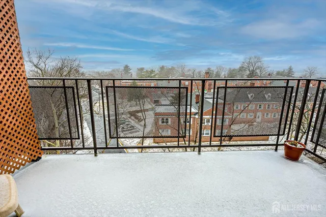 a view of a livingroom with a piano and wooden floor